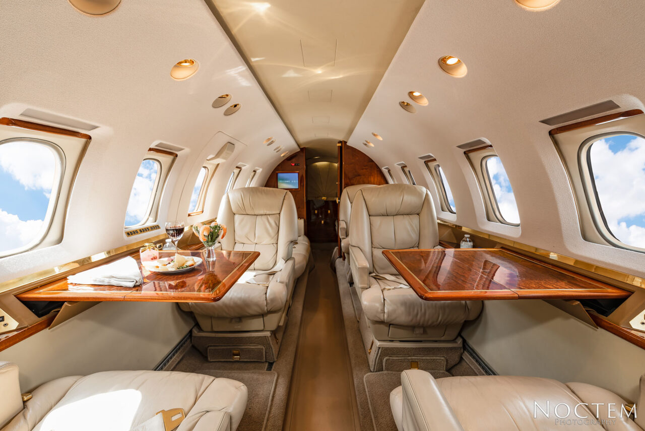 tables and individual chairs inside Hawker 800XP