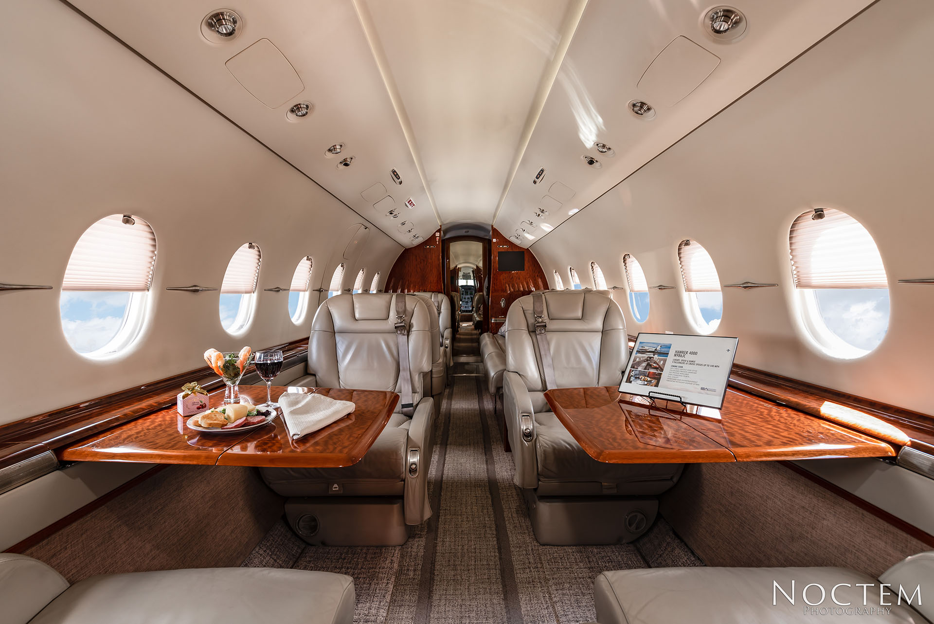 interior seating of Hawker 4000 with set tables