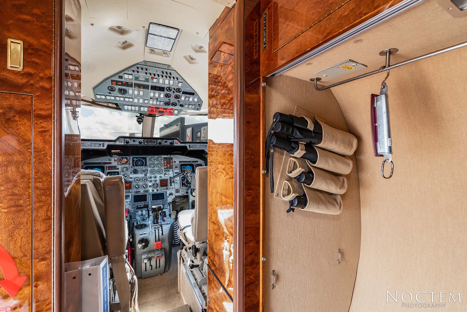 closet and cockpit entrance inside Hawker 800XP
