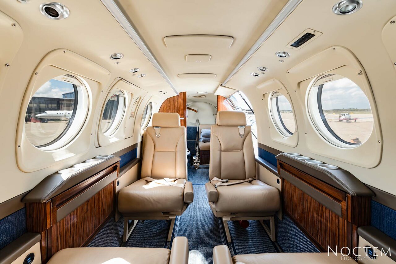 Seating inside King Air E90 with facing back of the plane